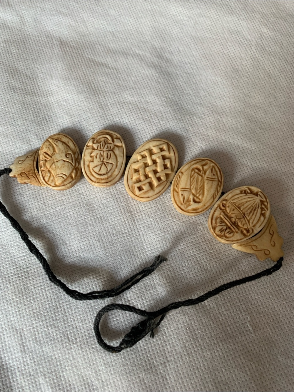 Carved Ivory-Tone Women’s Bracelet with Oval Symbol Beads